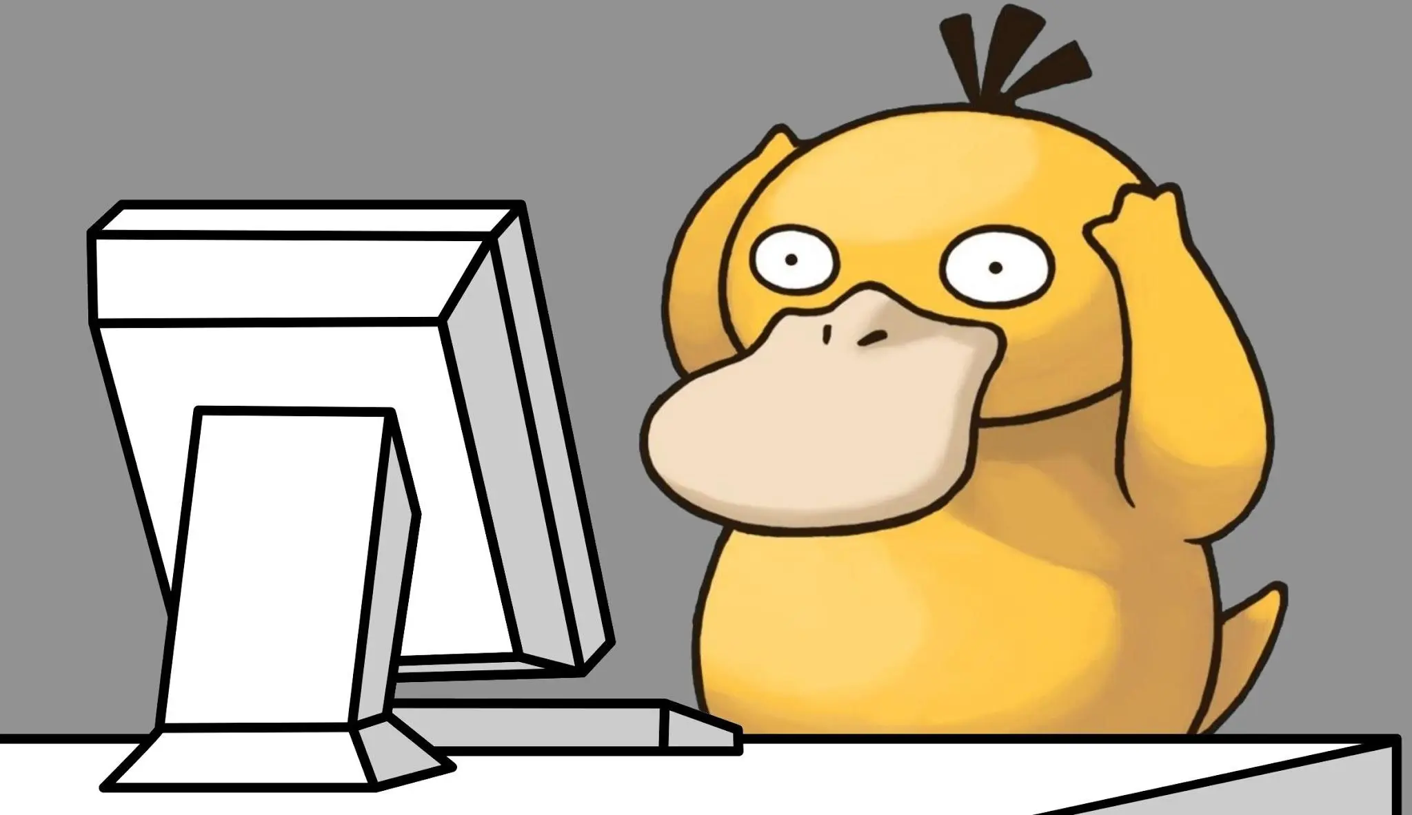 Psyduck from Pokémon in its confused pose, looking at a computer screen