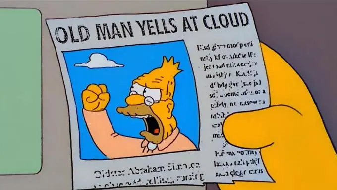 A character from The Simpsons, holding a newspaper clipping of "Old man yells at cloud", showing Abe Simpson with a clenched fist at a cloud.